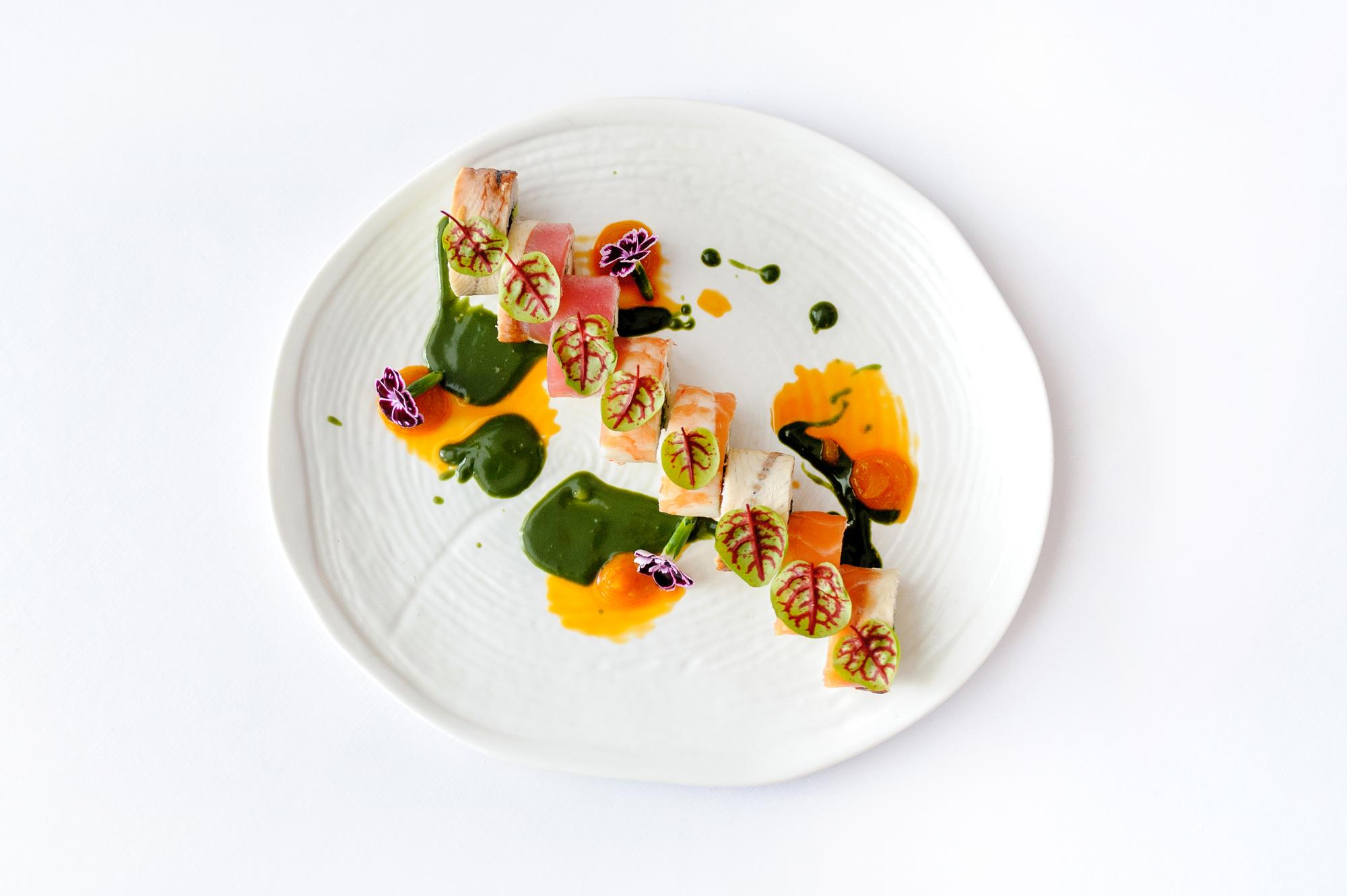 Plated tasting menu with garnishes